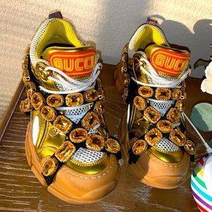 Gucci sneakers with rhinestones & gold straps.